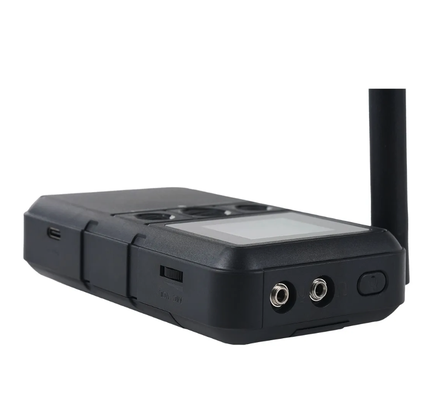 Close view of the transmitter's audio inputs and power switch